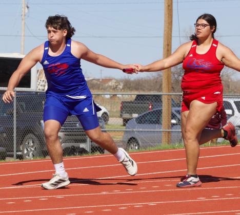 MIXED RELAY In the 4x100, Audri Perez hands off to Chase Rowland for Knox City in the final leg. MUNDAY HIGH SCHOOL competes in the high jump.