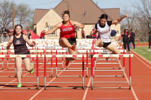 MUNDAY RUNNER gets out ahead of the pack in the 100M hurdles. SHERI BATY PHOTOS