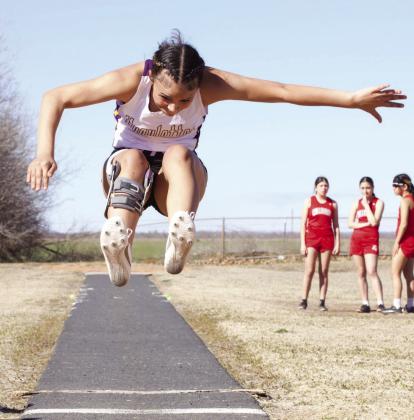MHS Ta'nya Lara glides through the air at the long jump | SHERI BATY PHOTO
