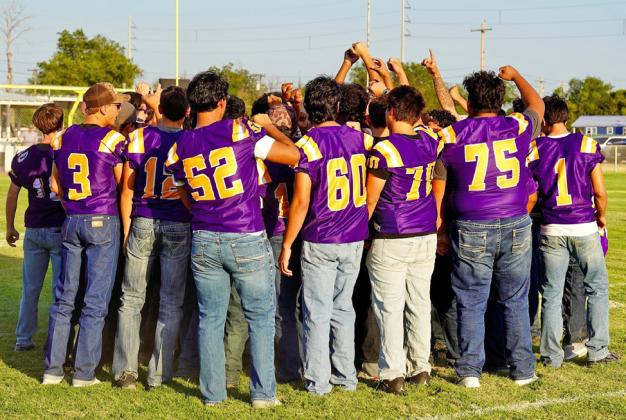 MOGUL FOOTBALL PLAYERS huddle to break it out for the first time in front of the home fans. The Moguls are under new head coach Jeff Ward hungry for a winning season and a playoff appearance.