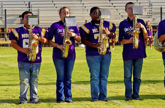 A QUARTET OF SAXOPHONE PLAYERS stays on tune as they belt out the Mogul fight songThursday at the annual Meet the Moguls and Mogulettes.