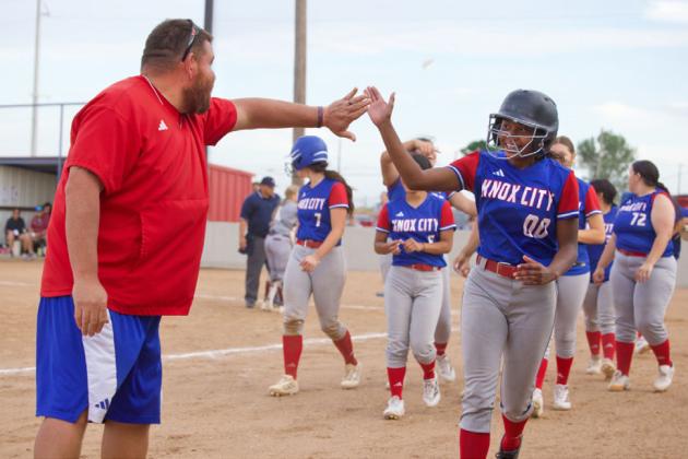 HOMERUN Coach Villanueva congratulates Naveah Martinez on her homerun. | SHERI BATY