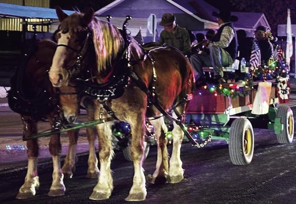 MAKING AN ENTRANCE Parade Grand Marshal Glenn Dell and Veterans make their entrance on horse and carriage driven by Mark Flores. See more photos on page 6A. | COURTESY PHOTO