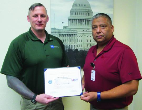 RECOGNIZINGBLUEBONNETDETENTIONCENTER Sgt.Rothermel (left) and Warden Villegas (right) proudly display the Patriotic Employer Award, recognizing Bluebonnet Detention Center’s commitment to supporting military service members in the workplace. | COURTESY PHOTO