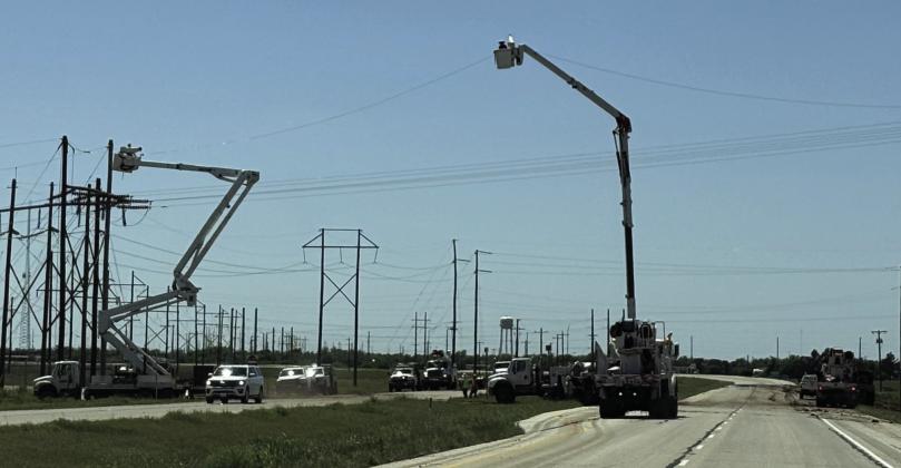 STORM CLEANUP PROGRESS Work continued Saturday afternoon May 3, 2025, to repair the electric infrastructure on Hwy 222 east of Munday after the previous week’s severe storms and straight line winds. | DON THOMPSON PHOTO