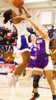 GOING OVER THE DEFENDER Houndette Neveah Martinez elevates over the Mogulette defender for two points. The Houndettes failed to get back in the win column when the Mogulettes came in with the win 60-25. | SHERI BATY PHOTO