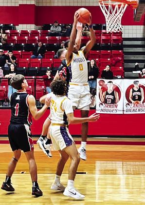 MOGULS PREVAIL Munday’s Ja'Riyis Williams grabs a defensive rebound in this week’s playoff victory over Aspermont. | SUE JANE SULLIVAN