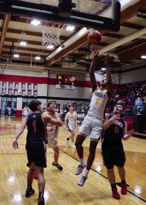 Ja'Riyis Williams grabs the rebound and puts it back up for two. | LACI BOWMAN