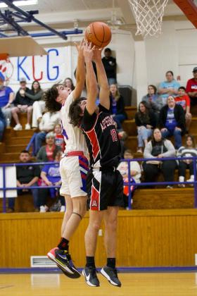 Jerry Grayson reaches for the rebound. | SHERI BATY PHOTO