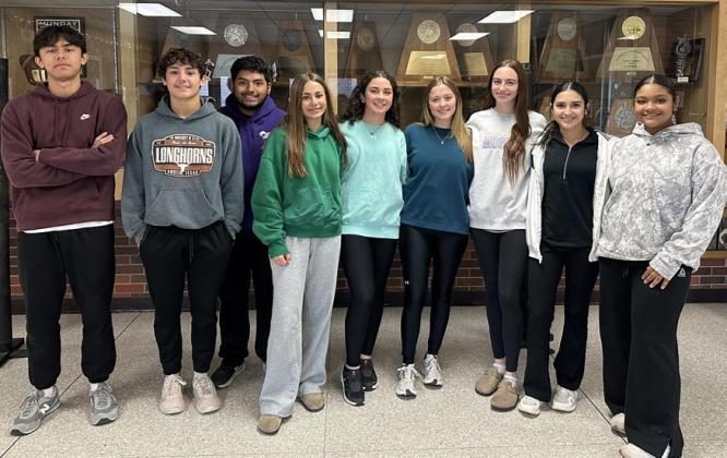 Munday High School teachers Karen Longan and Katie Wilde, along with Munday National Honor Society and student council members, decorated downtown Munday and helped clean up The Rock Church to prepare the city for the holidays. | COURTESY PHOTO