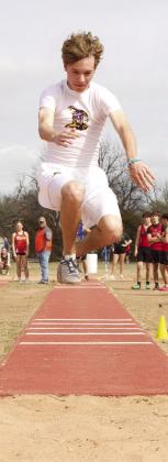 MHS triple jumper leaps into the sand. | SHERI BATY PHOTO