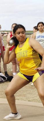 MHS Girls shot putter focuses on the distance marker. | SHERI BATY PHOTO