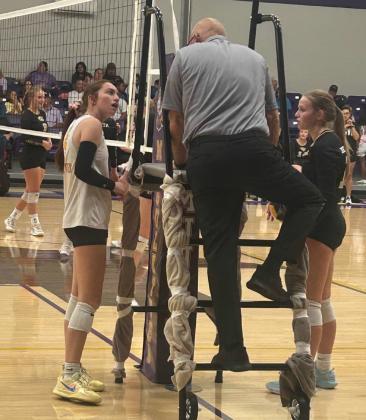 CAPITAN OLIVIA MYERS seeks an explanation for a changed call that cost the Mogulettes a point in a tight match.