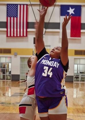 MUNDAY DOWNS ROTAN 28-23 Mogulettes’Makayla Martinez (right) hard at work under the basket during Tuesday night’s home basketball action; Kamryn Rocha scrambles after a loose ball. Munday’s girls (11-19) are scheduled to face 32-2 Eula Feb. 13 in a neutral-site playoff, after press time this week. Follow results on the News-Courier Facebook page. | LACI BOWMAN PHOTOS