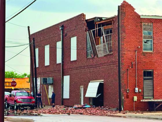 BRICK DESTROYED The Main Street Performance Auto shop in Munday, owned by J. R. Hodges, lost bricks and a window from its upper story when high winds blew through around 6:30 p.m. April 29. | RACHEL FARMER PHOTO