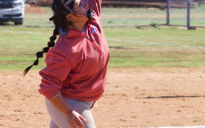GET UNDER IT Miley Arrietta catches the fly ball to left field.