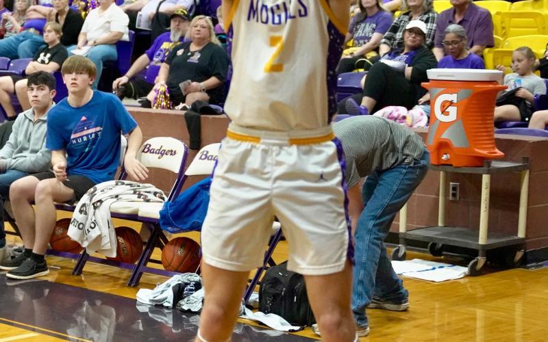 LUKE BOWMAN hits from deep for three of his 21 points.
