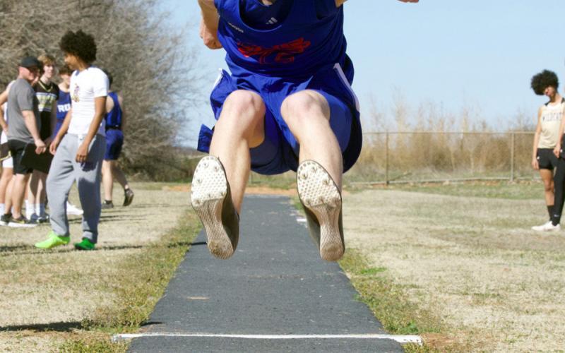 Bently Stroud competes in the long jump.