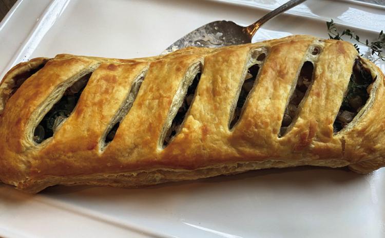 MUSHROOM WELLINGTON is a culinary delight you won’t want to miss! This dish beautifully combines earthy, rich mushrooms with a flaky, golden pastry that envelops a rich filling, creating a comforting yet sophisticated dining experience. | ANGELINA LARUE PHOTO