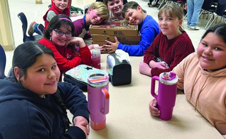 PENNY WARS WINNERS Excited Knox City students enjoying their pizza party reward for winning the Penny Wars. | COURTESY PHOTO