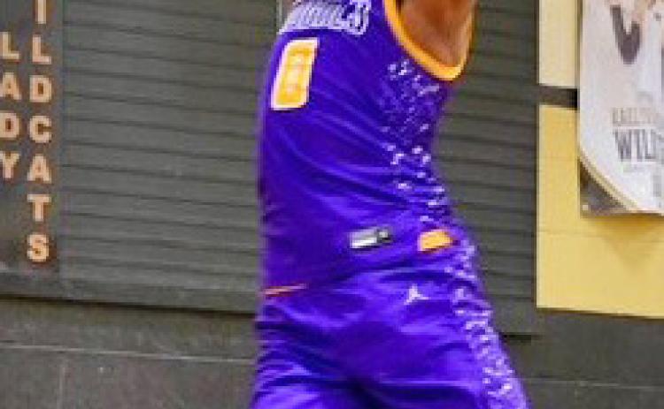 DUNKING IT IN Munday Mogul Ja’Riyis Williams dunks one in against Archer City in last week’s game. | LACI BOWMAN PHOTO