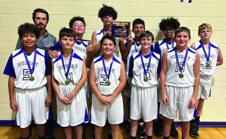 The Junior High Munday Moguls earned the Tournament Champions title this past weekend at their home tournament. The Munday Moguls remained undefeated in all three games of the tournament and earned a combined total of 111 points. The Moguls defeated Aspermont 32-27, Rotan 40-28, and Guthrie 39-33. Pictured here: Back Row: Coach Cory Stephenson, Xavier Flye, Josh Dockins, Casein Lee, Jordan Copeland. Front Row: Jermane Dockins, Bentley Irons, Bryson Nunez, Jon Hunter, Kayton Shahan Courtesy Photo