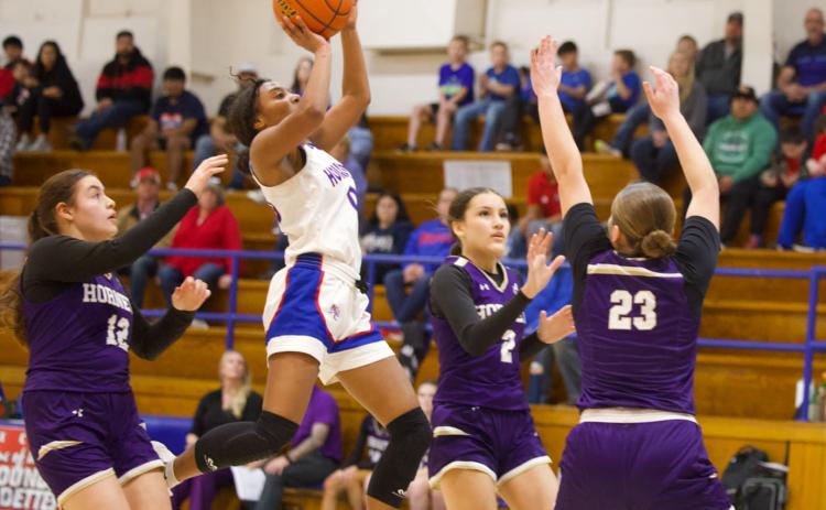 TWO POINTS DOWN Houndette Naveah Martinez knocks two points down from the lane against Harrold in Tuesday’s, Feb. 10 match-up. | SHERI BATY PHOTO