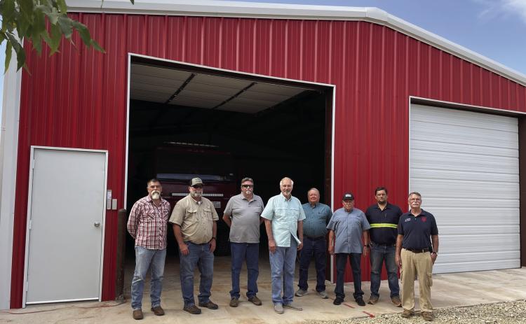 NEW HOUSING FOR FIRETRUCKS BenjaminVFD Chief Stephen Bisbee and Asst Chief Jacob Siemens thank the Knox County Judge and County Commissioners at completion of the project. | DON THOMPSON PHOTO