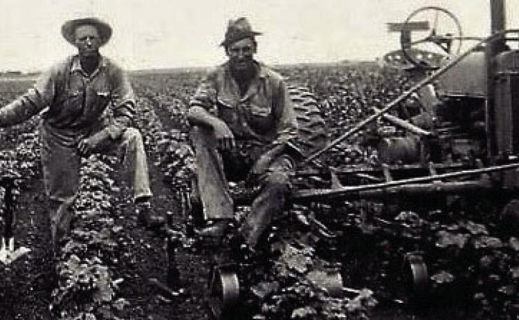 Ed Shaver on left, his son Eddie on right, sitting on John Deer Model A. On Ed’s Haskell Co. farm, @1939. Photo by Ed’s daughter Dorothy. Courtesy Photo