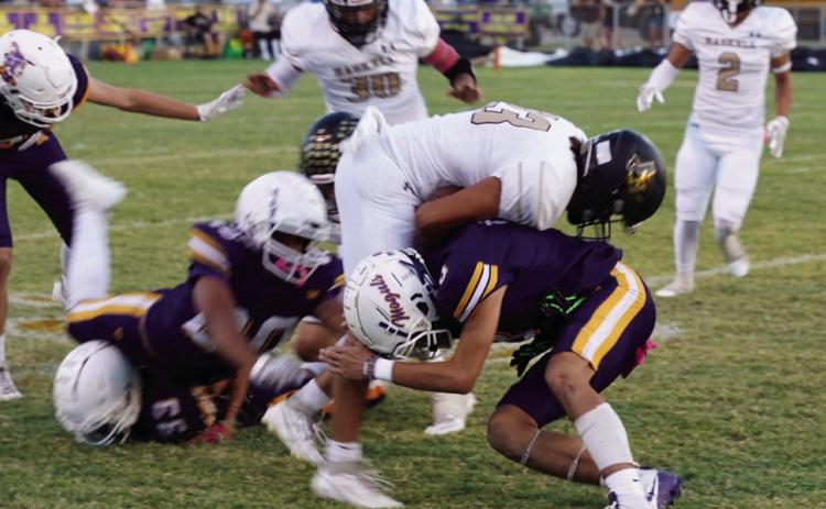 FRIDAY NIGHT KICKOFF Josh Dockins tackles the runner on the opening kickoff. | LACI BOWMAN