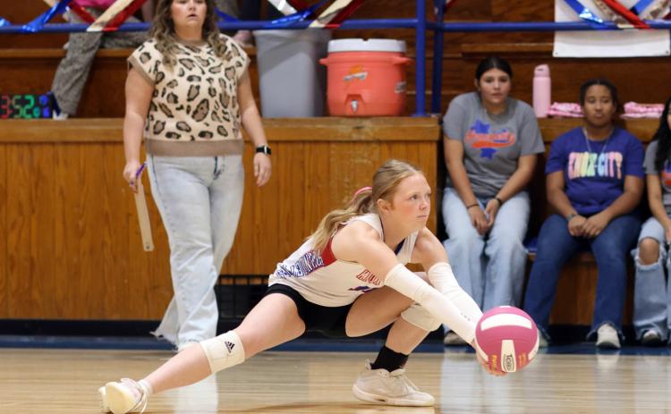 WAY DOWN Eren Howeth gets down to keep play alive with a great play Friday, Oct. 16, against Rotan, winning in 3 sets. | SHERI BATY