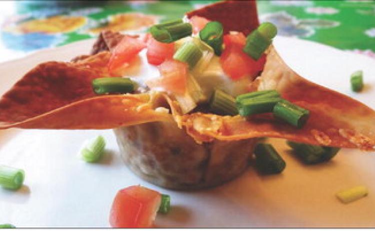 PARTY PREP Taco cups in muffin tins can be created by brushing egg-roll or wonton wrappers with oil to crisp in the oven, eliminating the need to for deep frying. | ANGELINA LaRUE PHOTO