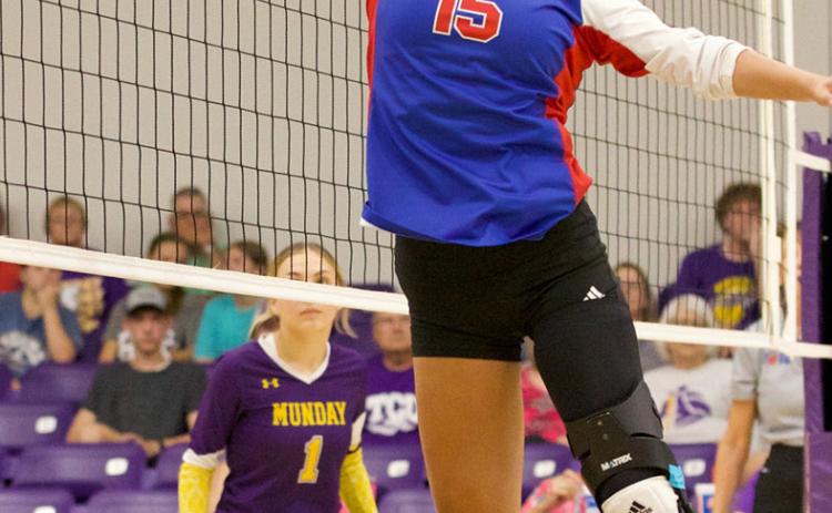 Krystabel Vasquez gets the tip over the net | SHERI BATY/NEWS-COURIER