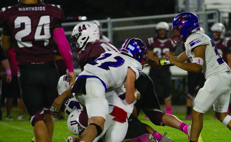 The Northside offense meets the brick wall of the KC Greyhound defense. | SHERI BATY PHOTO