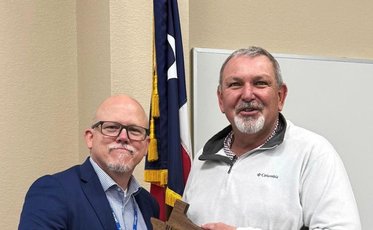 SERVICE TO EDUCATION Kenny Miller (left), deputy executive director of the Region 9 Education Service Center, was among those thanking retired Munday CISD superintendentTroy Parton for a decade-plus of service to the district. | COURTESY PHOTO