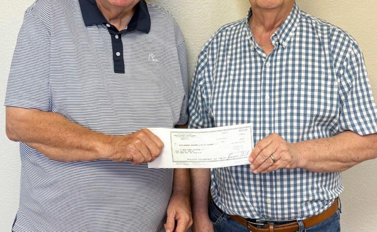 TO THE RESCUE Knox County Hospital CFO Dan Offut, left, received a $500,000 check from Knox County Judge Don Thompson for the purchase of a new ambulance. The funds were provided by HB 3000, passed in the most recent legislative session. | COURTESY PHOTO