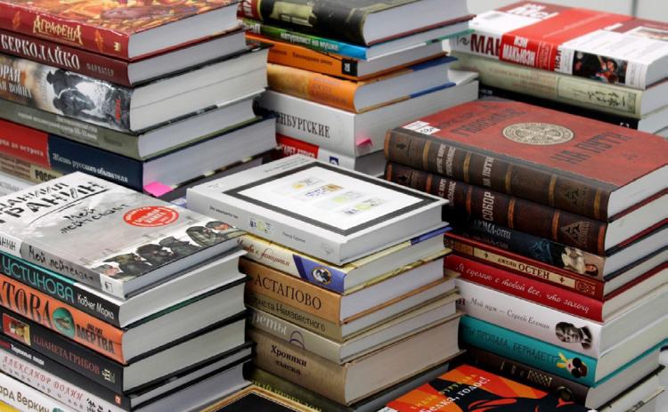 A giant stack of books. | UNSPLASH.COM