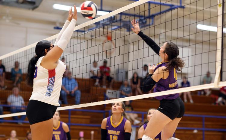 BATTLE AT THE NET Knox City’s Audri Perez and Munday’s Brooke Urbanczyk battle at the net. | SHERI BATY