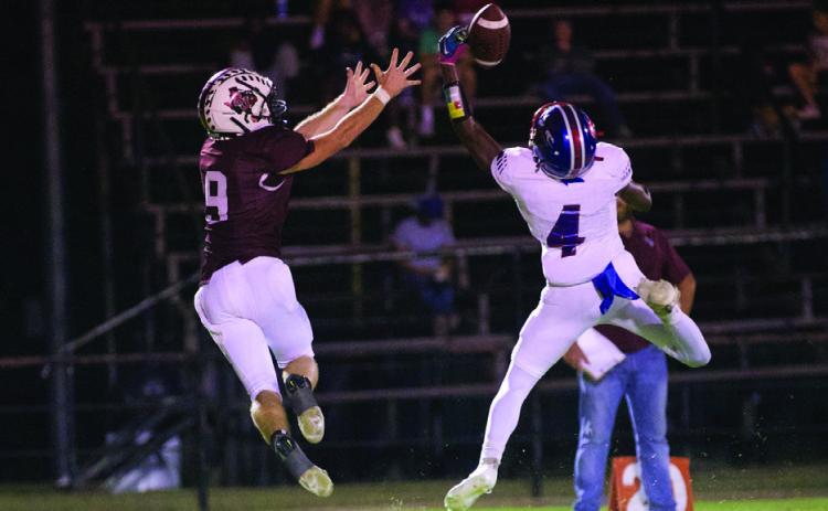 GREYHOUNDSWIN DevinGillorybreaksupthePantherreceptionin Knox City's 48-0 win over Saint Jo Friday night. | SHERI BATY PHOTO