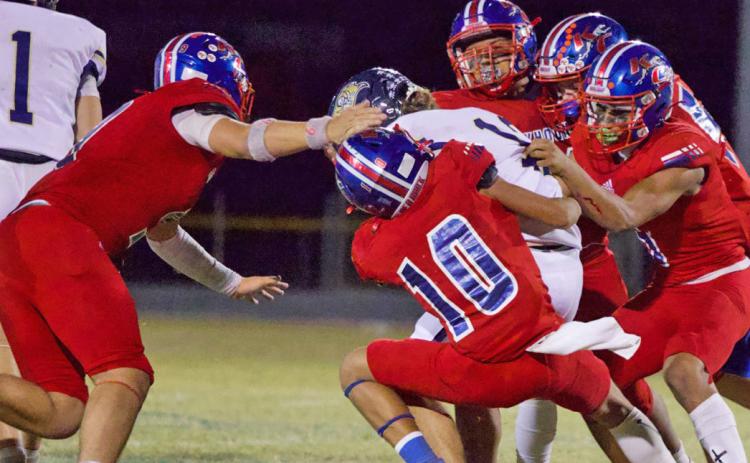 GODEFENSE The Greyhound defense makes the tackle in Friday’s win over Perrin-Whitt to finish off the season. | SHERI BATY PHOTO