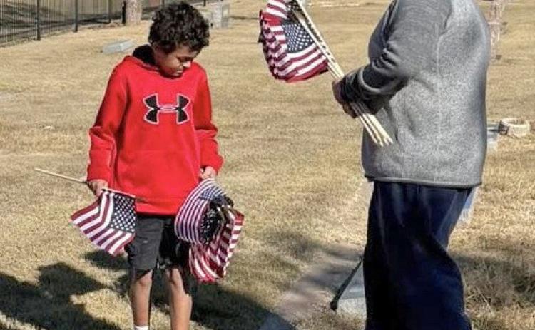 DAY Someofthestudentsfrom Benjamin Junior High School were out over the weekend placing flags on the graves of veterans at the cemetery in preparation of Veterans Day. | COURTESY PHOTOS