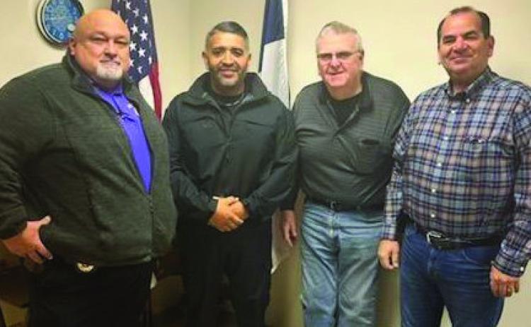 MUNDAY HAS A NEW POLICE OFFICER Pictured here from left Munday Police Chief Albert Deleon, new Officer Rey Bermea, with Mayor Bob Bowen and City Manager David Trevino. | COURTESY PHOTO