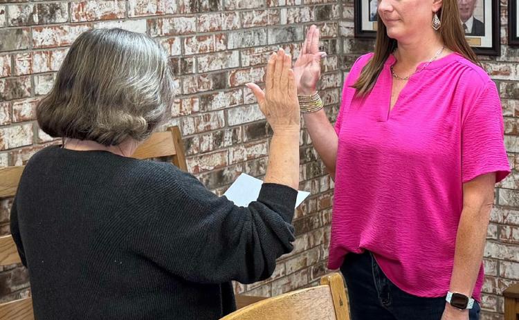 COMMITTING TO A SECOND TERM Jane Ann Bosworth was sworn in for her second term as Knox City council member by Deborah Berryman, during the May regular meeting secretary. | COURTESY PHOTO