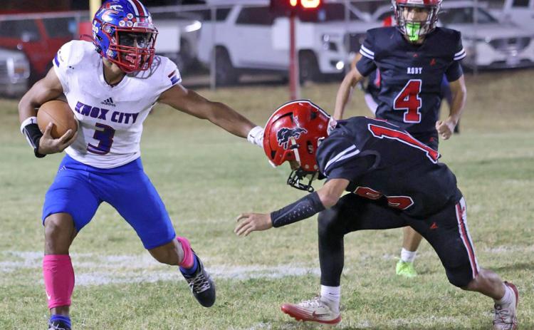 CAN’T TOUCH ME Zander Abila fends off a would be tackler, looking for a big gain. The Knox City Greyhounds won 86-80 in Roby Oct. 2. | SHERI BATY