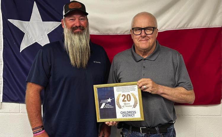 DWAYNE REDDER, Knox County maintenance, left, accepts his 20 years of service award from Childress District Engineer Darwin Lankford. Andrea Crownover, honored for 5 years of service, was not present for the awards ceremony. | TxDOT PHOTO