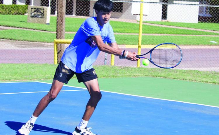 JoeAdamMorelosreturnstheballintheboysdoublesmatch.| SHERI BATY PHOTO
