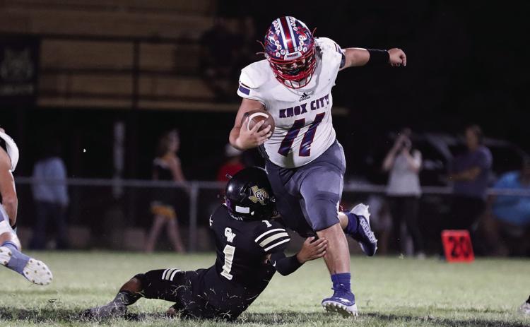 Tristin Baxter breaks the tackle and keeps trucking down the field Sheri Baty/The Knox County News-Courier