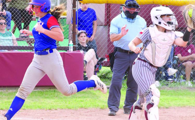 Savannah Friddle crosses the plate. | SHERI BATY PHOTOS