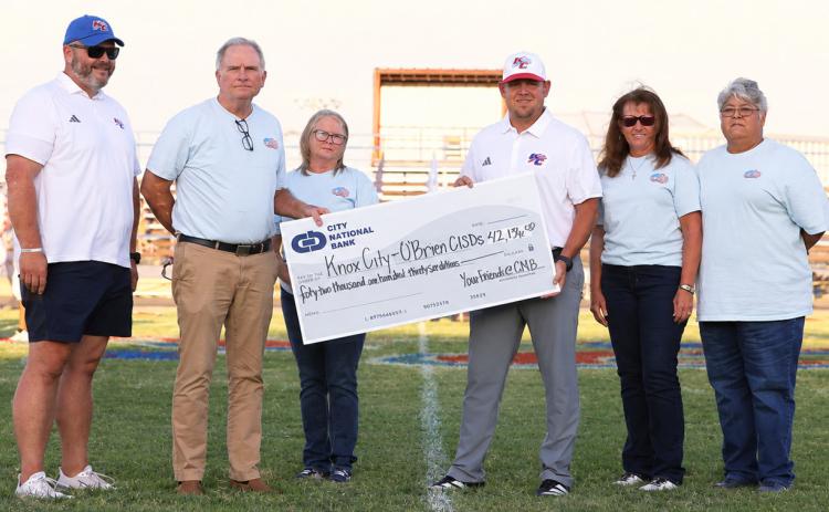 A MAJOR INVESTMENT City National Bank CEO presented Knox City coach Caleb Callaway with the check to purchase a new scoreboard and play clocks. On hand for the cerreomnywere,fromleft,Colin Howeth, Superintendent, Knox City O’Brien CISD; Wrey Montgomery, CEO, City National Bank; Caleb Callaway, Athletic Director/Head Football Coach, Knox City; Shyanne Scholl, COO, City National Bank, LaDonna Smith, Knox City Market President; and Faby Ledesma Vasquez, Knox City, City National Bank | COURTESY PHOTO