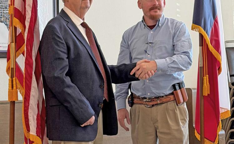 TOSUCCEEDMENDOZA RyanTrash was sworn in as Sheriff by Don Thompson, County Judge following a special meeting of the commissioners court Tuesday morning in Benjamin. Thrash has 12 years of law enforcement experience in Knox County. | COURTESY PHOTO